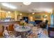 Open living room with tile flooring, leading to the kitchen at 232 Westchester Dr, Deland, FL 32724