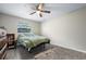 Cozy bedroom with luxury vinyl plank floors, natural light and neutral wall color at 2415 India Palm Dr, Edgewater, FL 32141