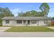 Charming single-story home with a well-maintained lawn and inviting curb appeal at 2415 India Palm Dr, Edgewater, FL 32141