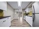 Spacious kitchen with modern appliances, white cabinetry, and a tiled backsplash at 2415 India Palm Dr, Edgewater, FL 32141