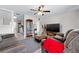 Spacious living room features neutral colors, ceiling fan, modern furniture and luxury vinyl plank flooring at 2415 India Palm Dr, Edgewater, FL 32141