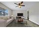 Inviting living room with sleek wood flooring and modern entertainment center at 2415 India Palm Dr, Edgewater, FL 32141