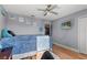 Light-filled bedroom with wood floors and a ceiling fan at 2479 Vaughn Ave, Deltona, FL 32725