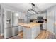 Modern kitchen featuring stainless steel appliances and a kitchen island at 2479 Vaughn Ave, Deltona, FL 32725
