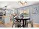 Eat-in kitchen featuring a cozy dining table and backyard views at 2479 Vaughn Ave, Deltona, FL 32725