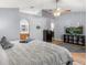 Serene main bedroom with wood floors, a ceiling fan, and ensuite bathroom access at 2479 Vaughn Ave, Deltona, FL 32725