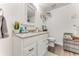 Bathroom featuring a vanity with storage, a well-lit mirror, and fresh decor at 2704 Oak Trail Run # 4, Port Orange, FL 32127
