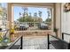 Relax on the patio with patterned outdoor rug, and views of the parking area at 2704 Oak Trail Run # 4, Port Orange, FL 32127