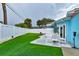 Artificial turf complements this backyard's clean, well-designed patio space at 28 River Dr, Ormond Beach, FL 32176