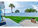 This backyard's artificial turf and modern landscaping offer a relaxing space to unwind at 28 River Dr, Ormond Beach, FL 32176