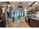 Open-concept kitchen with stainless steel appliances flowing into a bright, inviting living area at 28 River Dr, Ormond Beach, FL 32176