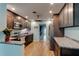 Modern kitchen showcasing dark cabinets, stainless steel appliances, and ample counter space at 28 River Dr, Ormond Beach, FL 32176