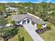 Aerial view of the home showcasing the driveway and landscaping at 29127 Old E Ml, Tavares, FL 32778