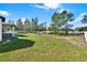 Large, well-maintained backyard with lush grass and mature trees at 29127 Old E Ml, Tavares, FL 32778