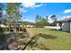 Spacious backyard features a shed and lawn equipment at 29127 Old E Ml, Tavares, FL 32778