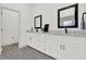 This bathroom features double sinks with modern fixtures and beautiful flooring at 29127 Old E Ml, Tavares, FL 32778