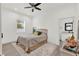 This bedroom features a ceiling fan, and a connected bathroom at 29127 Old E Ml, Tavares, FL 32778