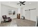 This bonus room features a barn door, chair, fan and plenty of space at 29127 Old E Ml, Tavares, FL 32778