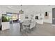 Open-concept kitchen, dining, and living areas leading to outdoor patio at 29127 Old E Ml, Tavares, FL 32778