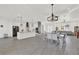 Open-concept floor plan with kitchen, dining, and living areas under decorative lighting at 29127 Old E Ml, Tavares, FL 32778
