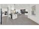 Open-concept floor plan with kitchen island, dining area, and living room with tile flooring at 29127 Old E Ml, Tavares, FL 32778