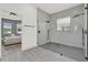 This main bathroom has a glass shower and modern fixtures with a view to a bedroom at 29127 Old E Ml, Tavares, FL 32778