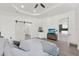 This main bedroom features recessed lighting, a ceiling fan, and a sliding barn door at 29127 Old E Ml, Tavares, FL 32778