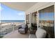 Relaxing balcony offers stunning ocean views with comfortable seating, perfect for enjoying morning coffee or evening sunsets at 2967 S Atlantic Ave # 301, Daytona Beach Shores, FL 32118