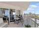 Inviting balcony features ocean views, a table, and chairs at 2967 S Atlantic Ave # 301, Daytona Beach Shores, FL 32118