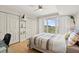 This light-filled bedroom offers balcony access and closet storage at 2967 S Atlantic Ave # 301, Daytona Beach Shores, FL 32118