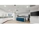 Bright kitchen boasts white cabinets, stainless appliances, and a blue island at 2967 S Atlantic Ave # 301, Daytona Beach Shores, FL 32118