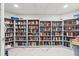 Well-stocked library featuring multiple bookshelves with a variety of books at 2967 S Atlantic Ave # 301, Daytona Beach Shores, FL 32118