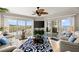 Comfortable living room features stunning ocean views through sliding glass doors and plenty of natural light at 2967 S Atlantic Ave # 301, Daytona Beach Shores, FL 32118