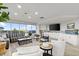 Spacious living room with modern furniture and a beautiful ocean view at 2967 S Atlantic Ave # 301, Daytona Beach Shores, FL 32118