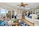 Bright living room with modern furnishings, elegant decor, and sliding glass doors to the ocean-view balcony at 2967 S Atlantic Ave # 301, Daytona Beach Shores, FL 32118
