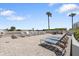 Sunny rooftop deck features chairs, loungers, and ocean views at 2967 S Atlantic Ave # 301, Daytona Beach Shores, FL 32118