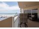 Inviting balcony with chairs overlooking the beach and parking at 2967 S Atlantic Ave # 301, Daytona Beach Shores, FL 32118