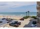 Expansive beach view from the property highlighting beach access and parking area at 2967 S Atlantic Ave # 301, Daytona Beach Shores, FL 32118