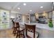 Modern kitchen with updated appliances and breakfast bar seating at 2967 S Atlantic Ave # 301, Daytona Beach Shores, FL 32118