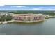 Aerial view of Venetian Bay condos offering waterfront views, multiple pools and lush landscaping at 3075 Meleto Blvd, New Smyrna Beach, FL 32168