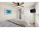 Bedroom with ceiling fan, TV, window, closet and cozy bed at 3075 Meleto Blvd, New Smyrna Beach, FL 32168