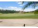Scenic golf course view in Venetian Bay with a lake and luxury homes in the background at 3075 Meleto Blvd, New Smyrna Beach, FL 32168