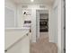 Hallway featuring carpet floors and views into the bedrooms at 3075 Meleto Blvd, New Smyrna Beach, FL 32168
