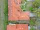 Aerial view showcases red tile roofs, lush greenery, and well-manicured lawns at 3145 Connemara Dr, Ormond Beach, FL 32174