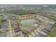 Distant aerial view showing the layout of the neighborhood, community ponds and residences at 3145 Connemara Dr, Ormond Beach, FL 32174
