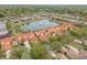 Community aerial view showcases the pond, fountain, and Mediterranean-style homes at 3145 Connemara Dr, Ormond Beach, FL 32174