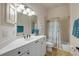 Clean bathroom with tub/shower and white vanity at 3145 Connemara Dr, Ormond Beach, FL 32174