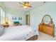 Charming bedroom with a cozy chair, natural light, neutral carpet, and stylish decor at 3145 Connemara Dr, Ormond Beach, FL 32174