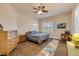Bedroom featuring wood floors, ceiling fan, and a neutral color palette at 3145 Connemara Dr, Ormond Beach, FL 32174