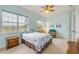 Bedroom featuring a blue comforter, carpet, natural light, and soft, neutral paint at 3145 Connemara Dr, Ormond Beach, FL 32174